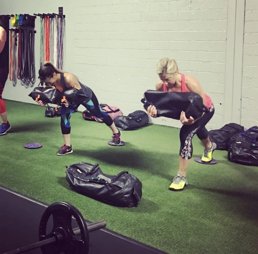 ultimate sandbag glute exercises