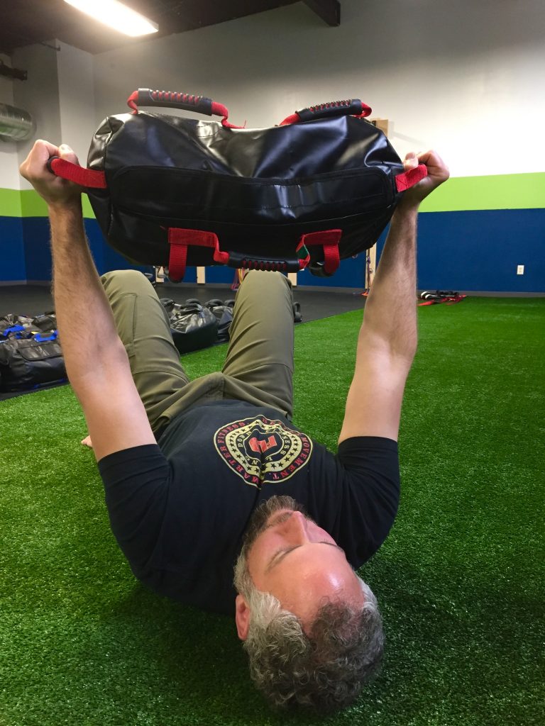 sandbag glute bridge