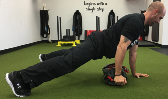 ultimate sandbag plank lateral drag
