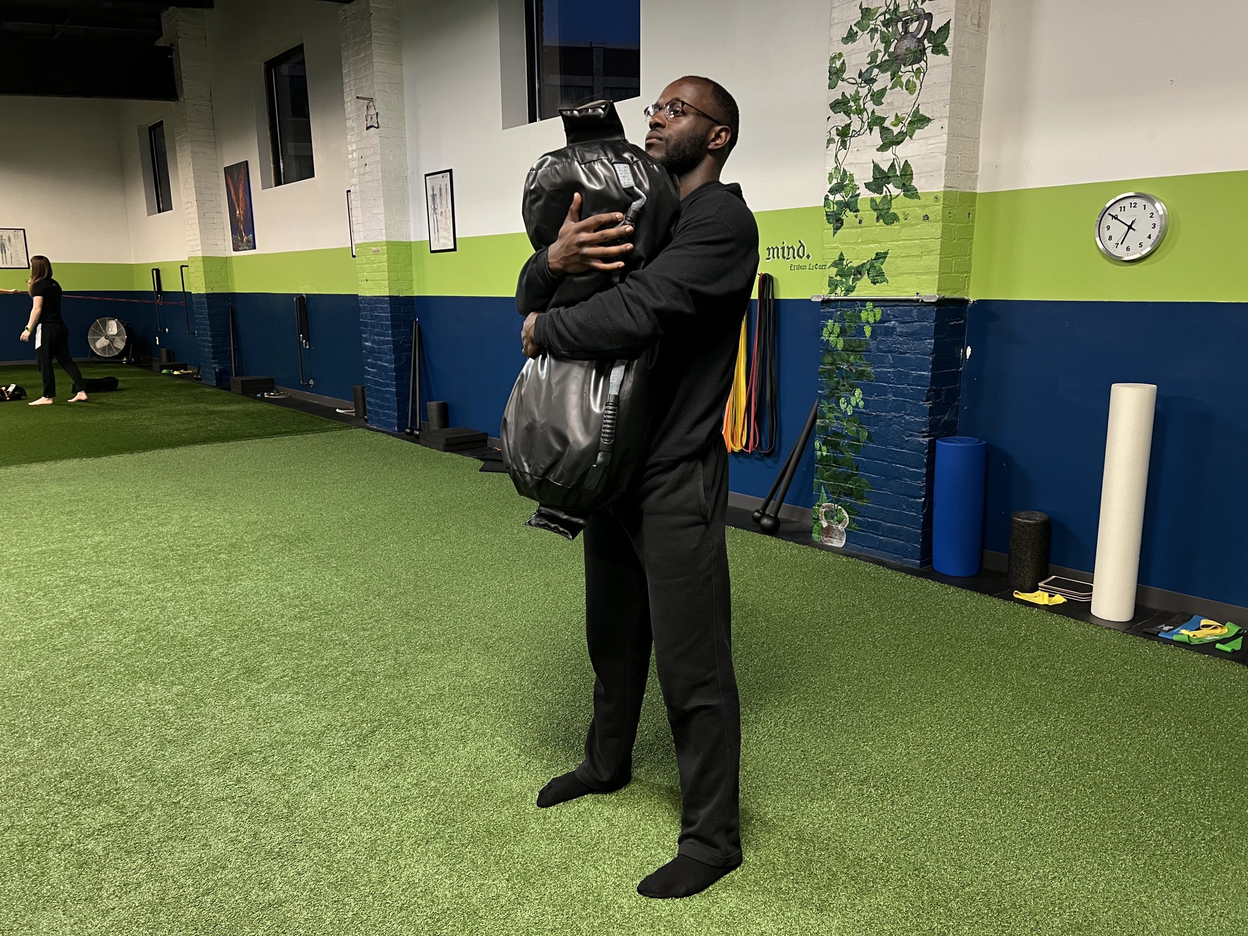 ultimate sandbag bear hug squat